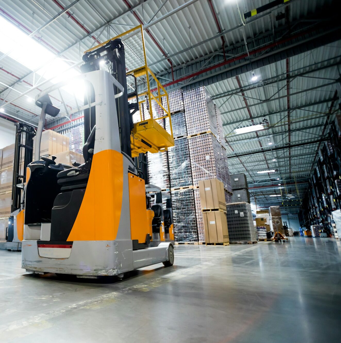 Forklift in huge warehouse